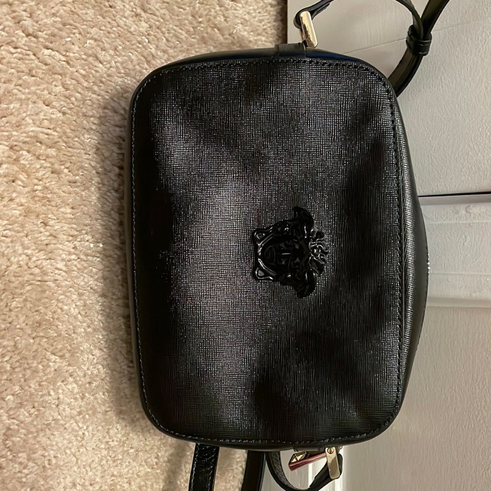 Woman’s Versace crossbody bag.